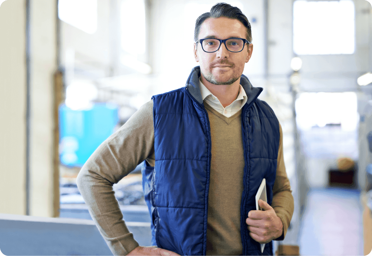 he carries a tablet signifying how AI affects supply chains in 2025