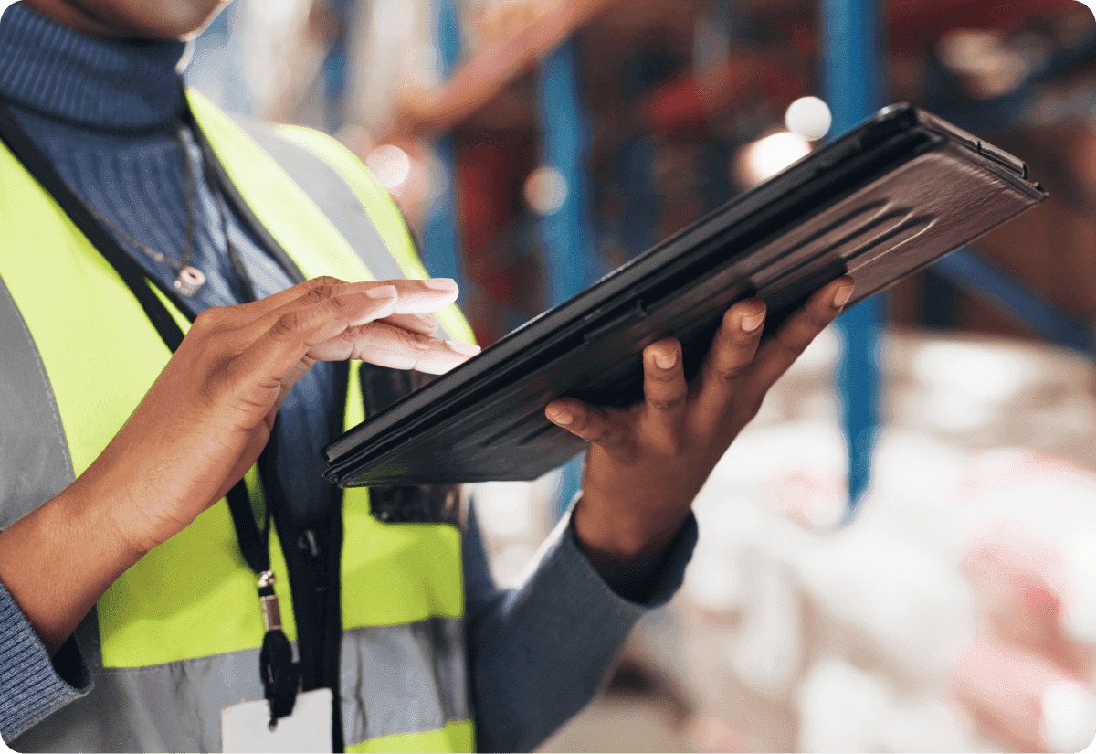 woman demonstrating the role of ai in supply chain through interactive software