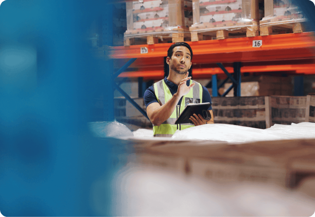 warehouse worker utilizes predictive analytics solutions to help improve supply chain processes