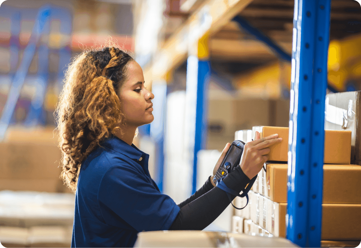 A warehouse employee making good use of warehouse space