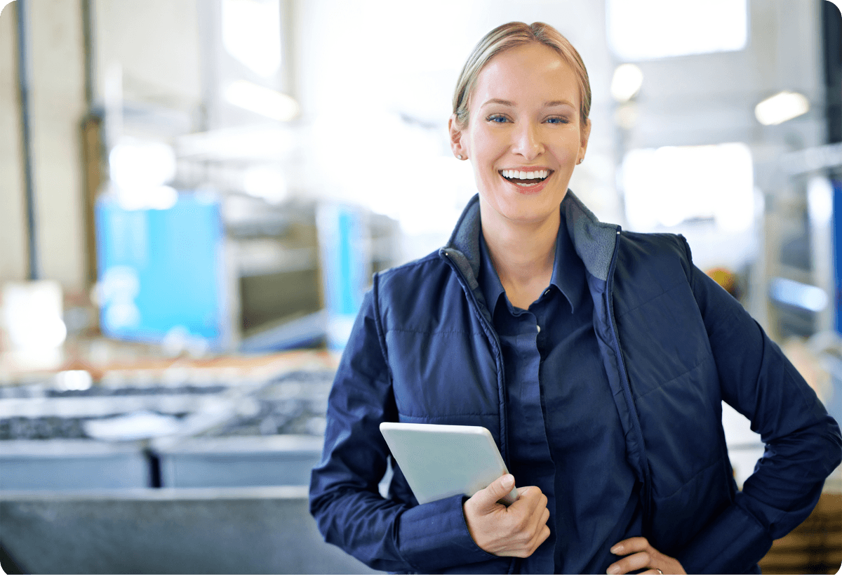 smiling logistics company owner ensuring inventory control with shopify fulfillment in her device