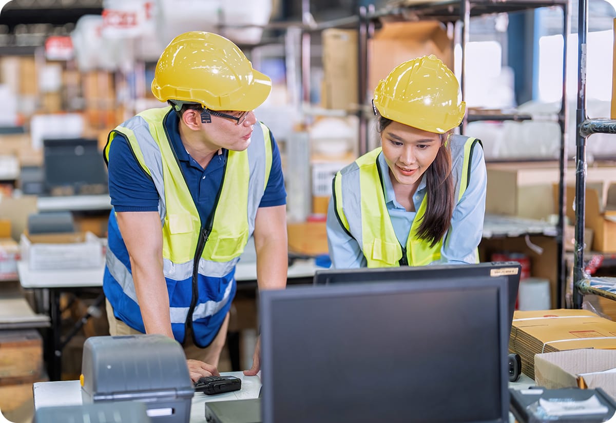 warehouse workers evaluating and improving their warehouse layout design