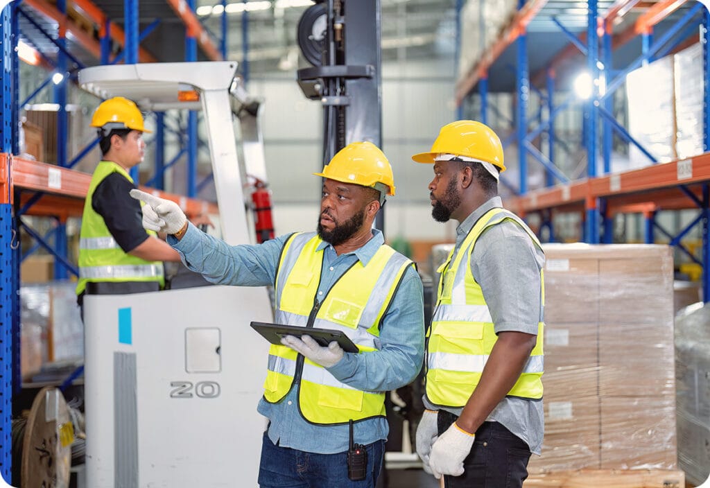 warehouse employees evaluating warehouse size of supply chain