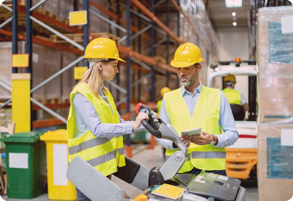 Warehouse workers testing a new logistics software