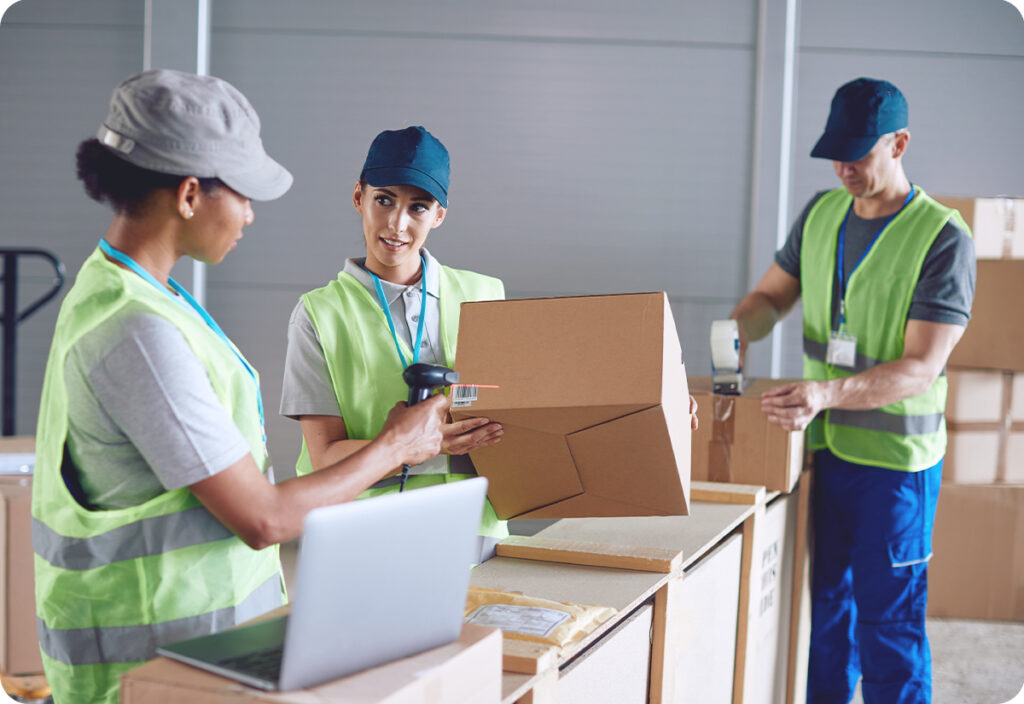 Employees in a storage area demonstrating effective small business inventory control