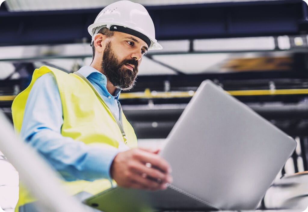 He goes over freight broker contracts via laptop