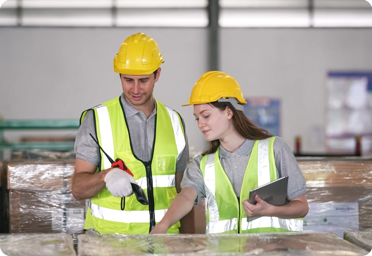 Warehouse employees showcase importance of freight analysis by conducting one while going through packages