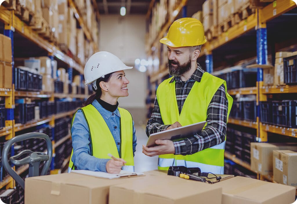 Warehouse managers working on logistics route planning to minimize delivery delays