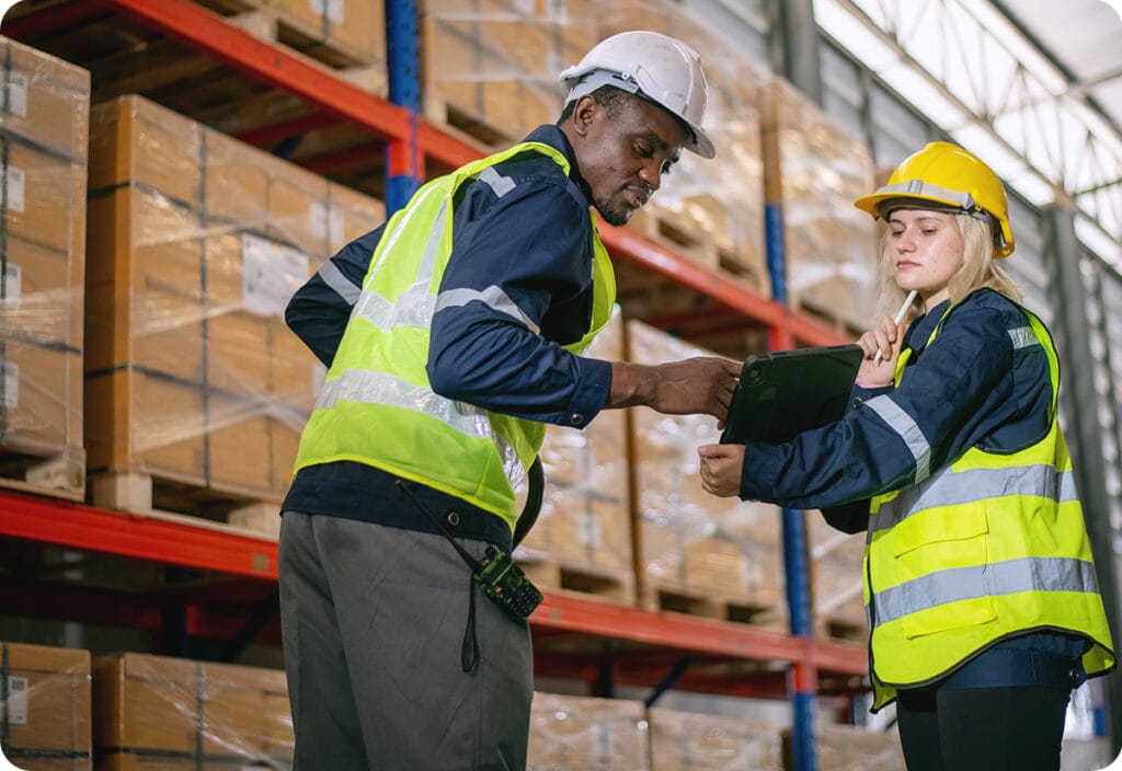 Warehouse employees using smarter inventory planning techniques for parcels