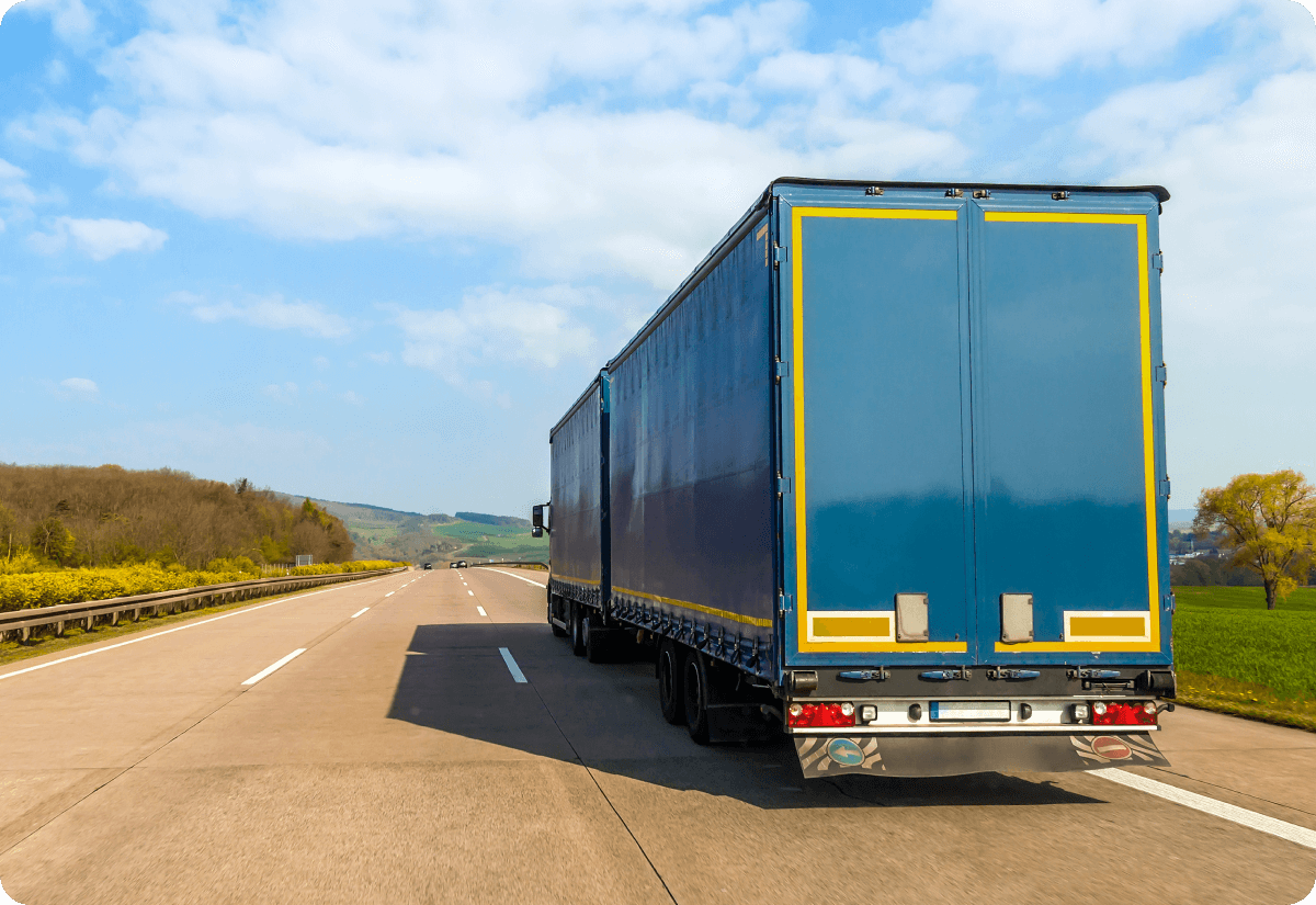 Refrigerated truck on a highway supporting cold chain integrity across the supply chain.